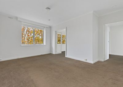 Photo of a room in a house in St Kilda, VIC before new was carpet installed by Investa Projects.