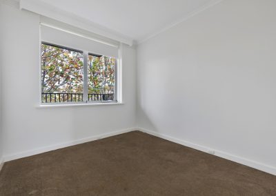 Photo of a room in a house in St Kilda, VIC before new was carpet installed by Investa Projects.